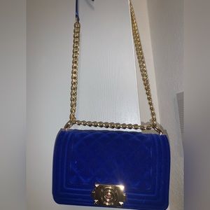 Dark blue Velvet purse with gold chain and matching blue strap for comfort.